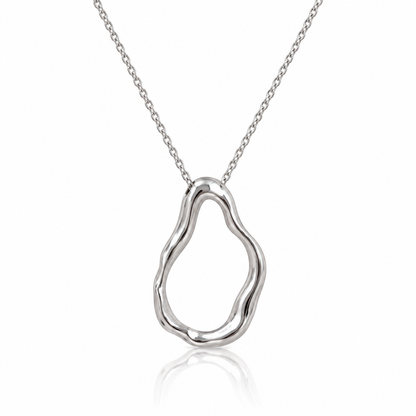 Silver-tone necklace with a large, irregular open-loop pendant and a flowing polished outline. Shown on a white background with a subtle reflection.